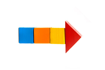 directional arrow signs made of wooden colorful building blocks  isolated on white