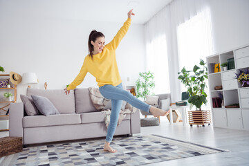 Full size portrait of overjoyed satisfied person dancing chilling living room house indoors - Powered by Adobe