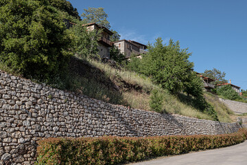 Street view in Dimitsana, a picturesque mountain village, built like am amphitheatre, surrounded by mountain tops, Arcadia, Peloponnes, Greece.