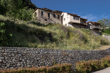 Street view in Dimitsana, a picturesque mountain village, built like am amphitheatre, surrounded by mountain tops, Arcadia, Peloponnes, Greece.