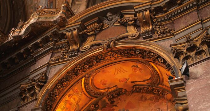 Impressive Church Interior With Artistic Sculptures And Paintings. San Camillo de Lellis Church On Via Sallustiana, Rome, Italy. low angle, pan right