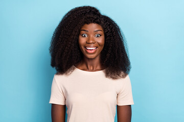 Fototapeta premium Photo of astonished positive girl cant believe unbelievable news isolated on blue color background
