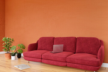 3d rendered illustration of a modern living room with red sofa and orange painted wall.