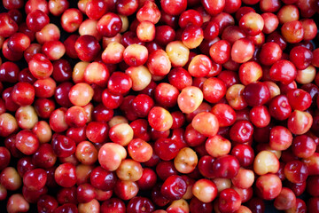 A lot of sweet cherries on a table