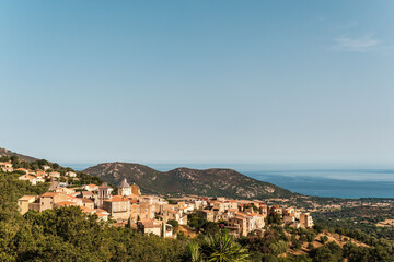 Fototapeta na wymiar The village of Cateri in the Balagne region of Corsica with Mediterranean sea in the distance