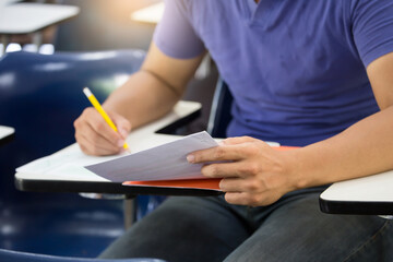 high school,university student study.hands holding pencil writing paper answer sheet.sitting...