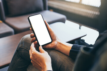 cell phone blank white screen mockup.hand holding texting using mobile on desk at office.background empty space for advertise.work people contact marketing business,technology