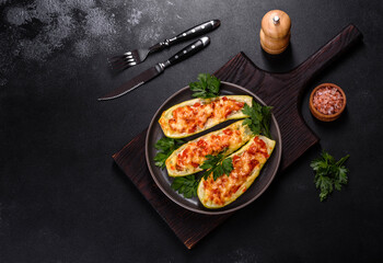Baked stuffed zucchini boats with minced chicken mushrooms and vegetables with cheese