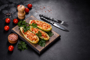 Baked stuffed zucchini boats with minced chicken mushrooms and vegetables with cheese