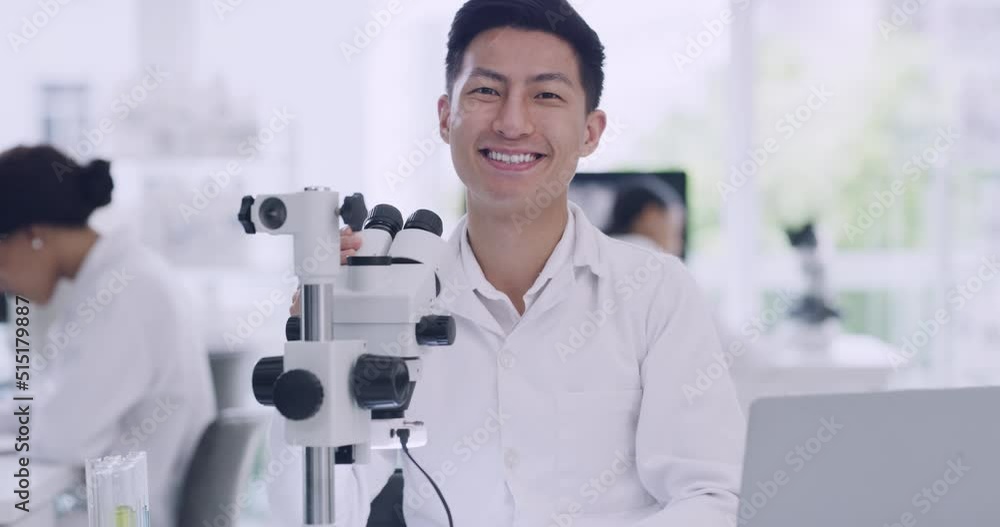 Poster Chemist looking at medical samples while conducting experiment and collecting data. Handsome chemist discovering a cure. Portrait of leading scientist using microscope in busy lab to find a cure
