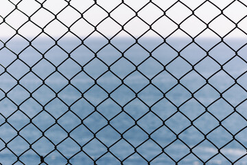 chain link fence with sky