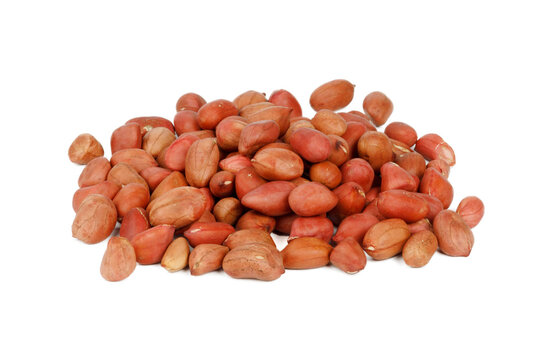 A bunch of brown peanuts on a white background.