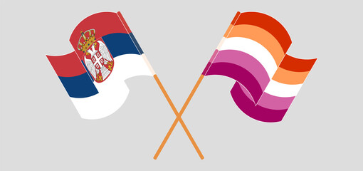 Crossed and waving flags of Serbia and Lesbian Pride