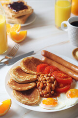 Traditional British breakfast with sausages and beans