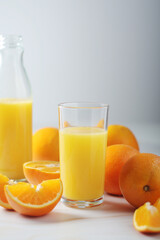 Oranges and orange juice in glasses