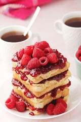Sandwiches with peanut butter and raspberry jam