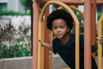 African kid smiling while playing at playground