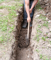 In the nature protection zone, you have to dig a trench under the electric cable manually.