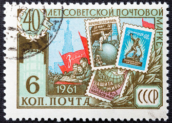 RUSSIA - CIRCA 1961: Stamp printed in USSR Russia shows Old Soviet postage stamps commemorating Peace, series The 40th Anniversary of First Soviet Stamp, circa 1961