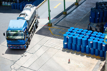 Top view oil barrels truck move for on the transportation worker help