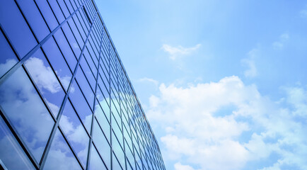 Windows of modern business building office concept with skyscraper for work with the perspective background cloud in the sky