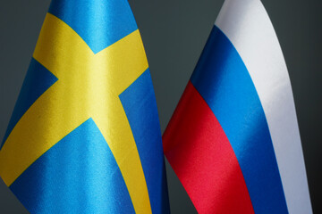 Close-up of the flags of Sweden and Russia.