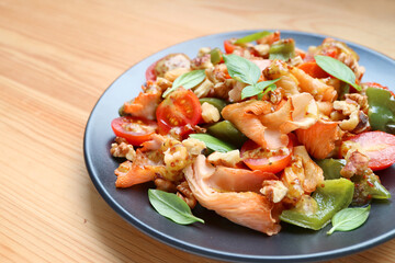 Plate of Tasty and Healthy Sauteed Pink Oyster Mushrooms with Colorful Vegetables