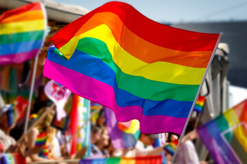 Lgbt pride rainbow flag during parade in the city .