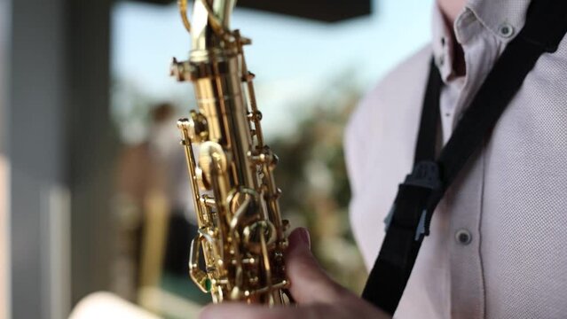 a man plays the saxophone on a holiday in a restaurant