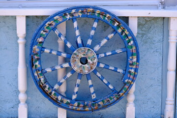 Decorative carriage wheel painted blue and white