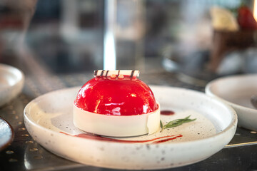 A strawberry butter cake in white ceramic plate. Bakery food object photo.