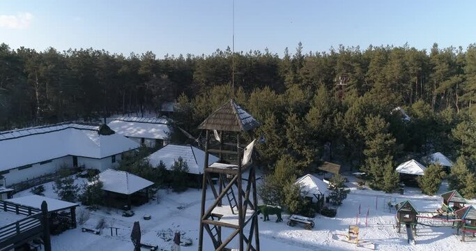 Restaurant near the forest in winter. Recreation center near the forest in winter. Beautiful cottage near the forest view from above