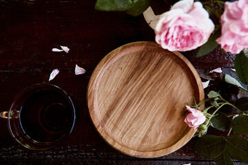 Mock up menu or recipe wooden plate, podium with pink tea rose. Morning aesthetic. Invitation, wedding, Mothers day card mockup. Place for text. View from above.
