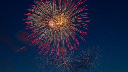 Fireworks light up the sky with dazzling display. Abstract colored firework background with free space for text.