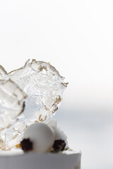 Transparent lollipops in the shape of a white heart. edible ice and gold foil. Valentine's day. 