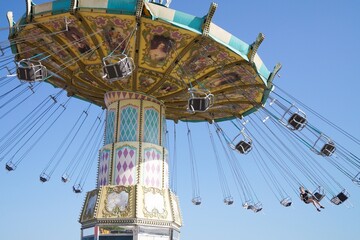Volgograd, Russian Federation, June 19, 2022 - Swing carousel in an amusement park on the Volga...