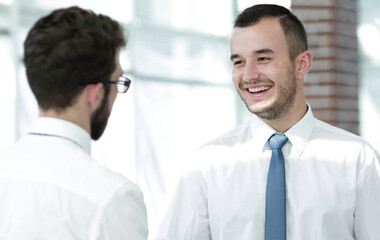 employees greet each other by shaking hands