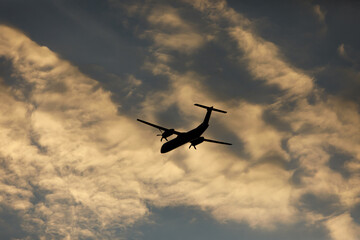 Turboprop air plane with propellers flying in the sky.