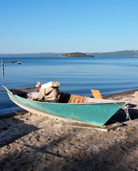 boat on the shore of lake bolsena near marta lazio italy