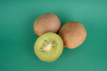 kiwi fruit on green background