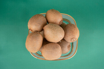 kiwi fruit on green background