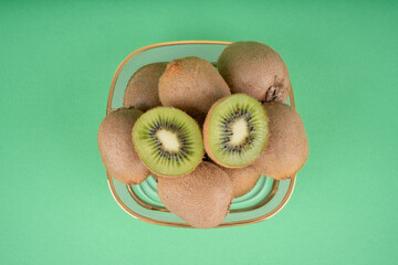 kiwi fruit on green background