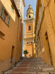 The Basilica of Saint-Michael the Archangel in Menton, France. The tall bell tower on the right...
