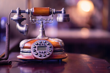 An antique telephone in an old room that is probably over a hundred years old