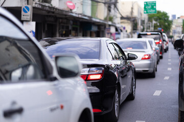 A large number of cars on the road in heavy traffic causes a lot of pollution