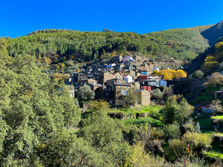 The picturesque little schist village of Piodão clings to a steeply terraced mountainside deep within the foothills of the Serra de Açor range in central Portugal.