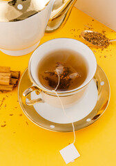 Ceylon cinnamon tea cup and box mockup. Organic cinnamon. Sri Lankan. White tea tag area for your logo.