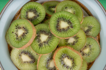 kiwi fruit on green background