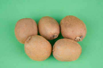 kiwi fruit on green background