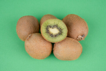 kiwi fruit on green background